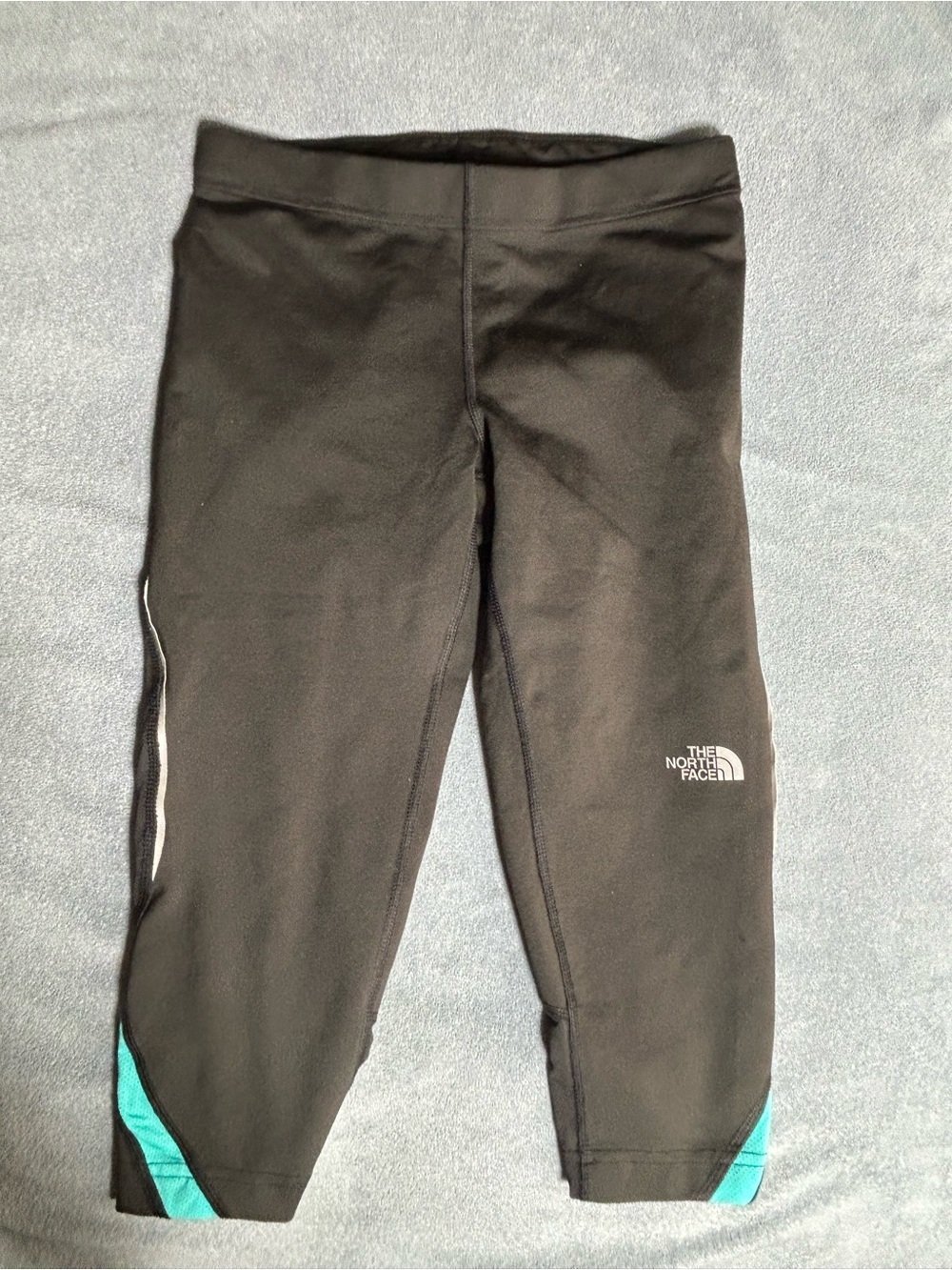 The North Face Black Capri Leggings with Teal Hem Panels